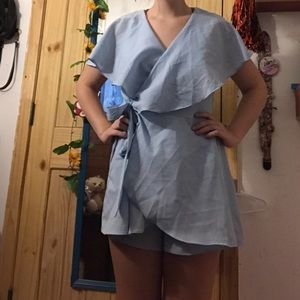 A cute baby blue romper that makes a bow!!